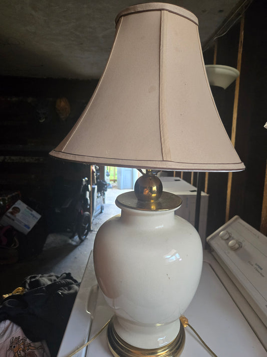Gold and eggshell colored medium sized lamp